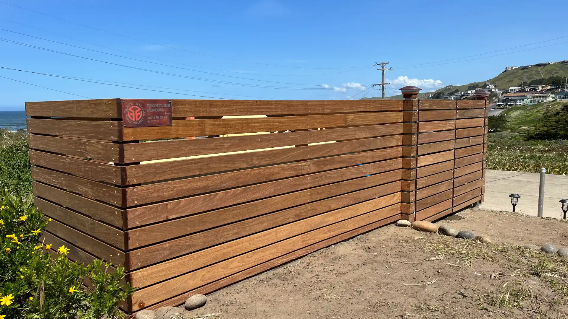 wooden fence to block off outside gas container