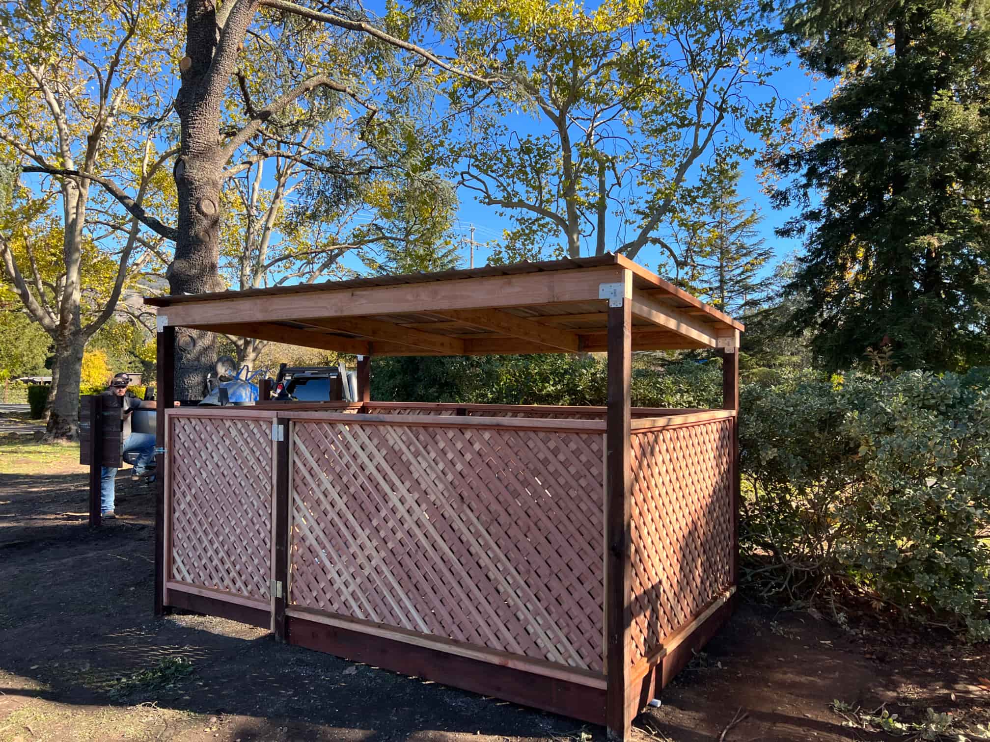 sideview of trash enclosure made of wood