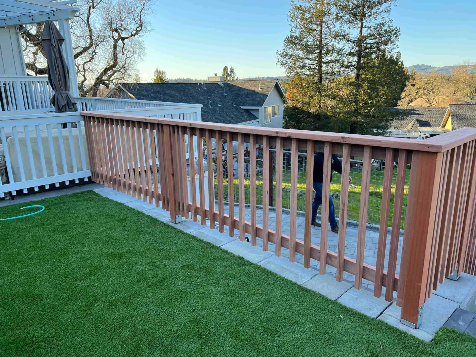 wooden railing and grass near by