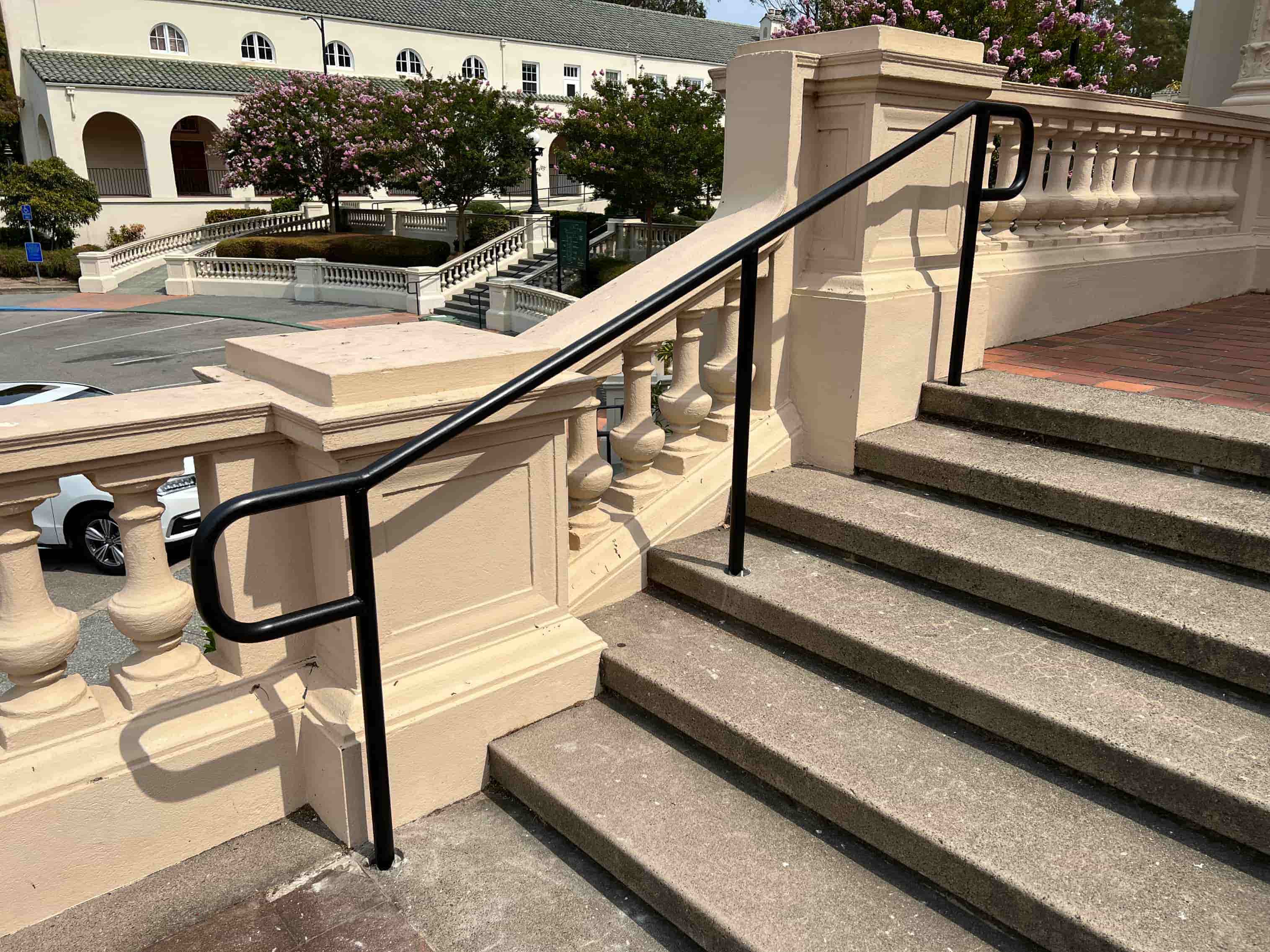 metal railing with cherry blossoms in background